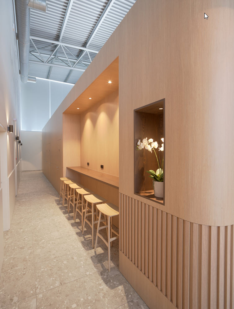 Sunrise Lounge renovation featuring HPL by Unilin Panels transports travelers to warmer destinations